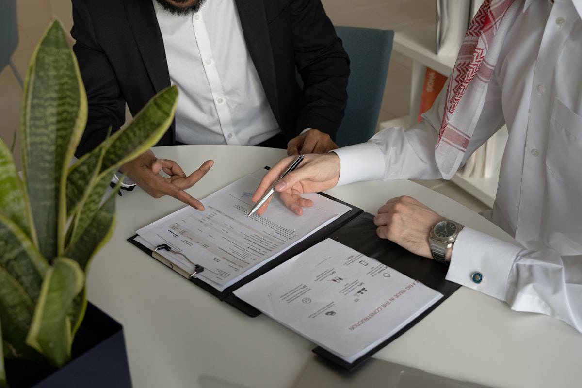 Advisor and client reviewing retirement paperwork together